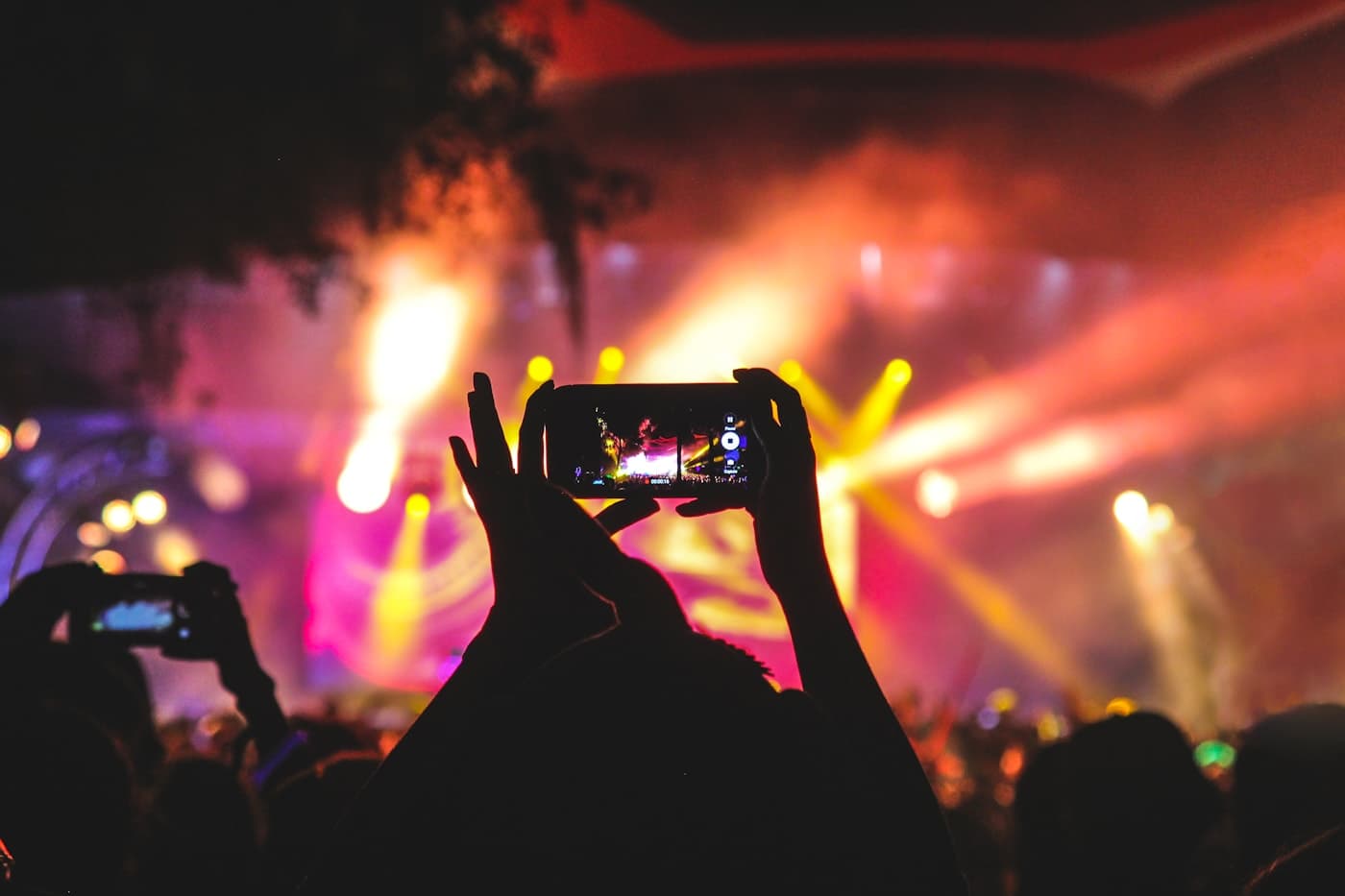 Concert crowd with stage lights for event chauffeur pickups